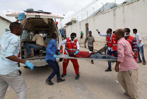 Rescuers carry a wounded man from the scene of an explosion to an ambulance in Hodan district, Mogadishu, Somalia, September 10, 2018. PHOTO BY REUTERS/Feisal Omar