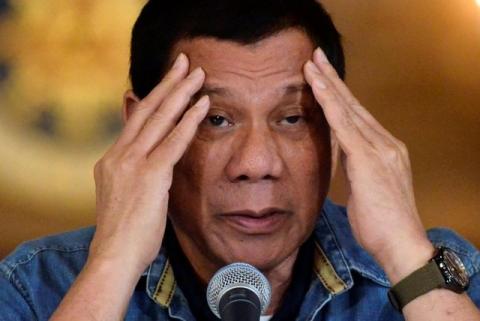 Philippine President Rodrigo Duterte gestures while speaking during a late night news conference at the presidential palace in Manila, Philippines, January 29, 2017. PHOTO BY REUTERS/Ezra Acayan
