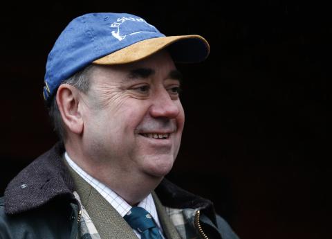 Scotland's First Minister Alex Salmond smiles as he attends the opening day of salmon fishing season on the river Tay at Dunkeld in Scotland