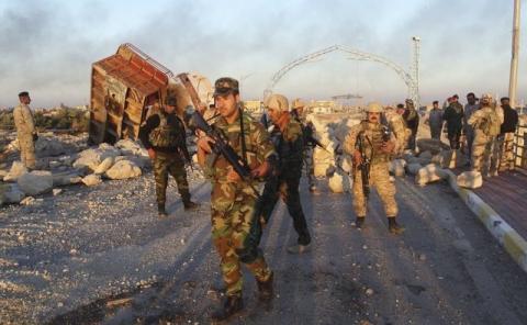 Iraqi security forces gather to advance towards the centre of Ramadi city, December 25, 2015. PHOTO BY REUTERS/Stringer