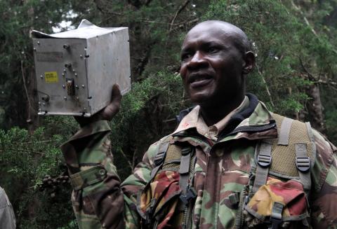 A security personnel carries an electric equipment from a single turboprop Cessna Caravan plane, operated by local firm FlySax, that crashed in a forested cliff in the Aberdare Range, in central Kenya, June 7, 2018. PHOTO BY REUTERS/Stringer