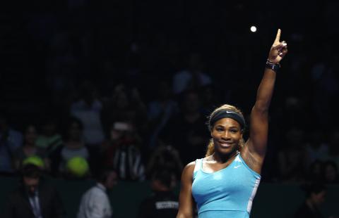 Serena Williams of the U.S. celebrates her victory against Ana Ivanovic of Serbia during their WTA Finals singles tennis match in Singapore, October 20, 2014. PHOTO BY REUTERS/Edgar Su