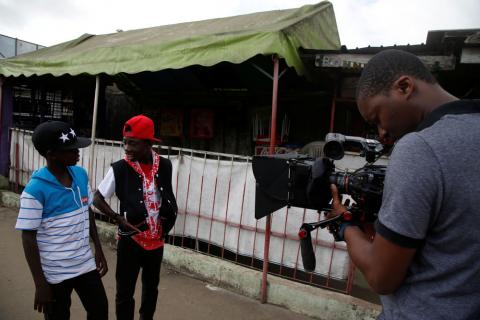 Coulibaly Lassina, 16, and Yao Kouame Alexis Wilfried, 18, play their roles during the shooting of a sequence of TV series Invisibles in Abidjan, Ivory Coast, September 21, 2017. PHOTO BY REUTERS/Luc Gnago