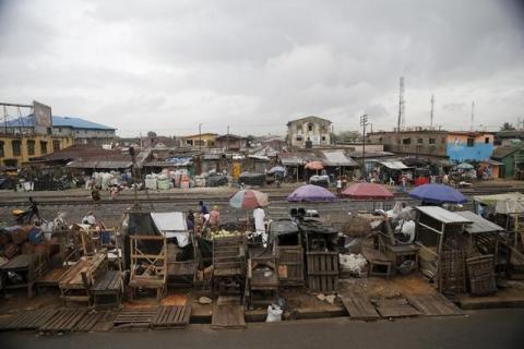 Slum houses are seen built along a train track in the Agege district in Nigeria's commercial capital Lagos, April 12, 2016. PHOTO BY REUTERS/Akintunde Akinleye