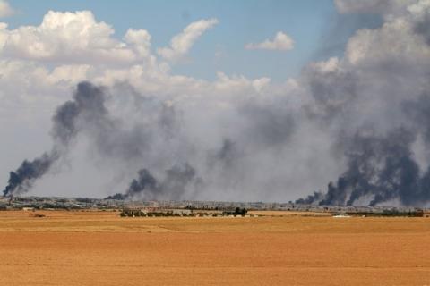 Smoke rises from Manbij city, Aleppo province, Syria June 8, 2016. PHOTO BY REUTERS/Rodi Said