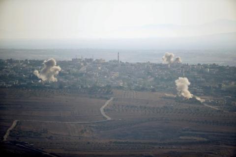 Smoke from explosions rises during fighting in the village of Jubata Al Khashab in Syria, as seen from the Israeli side of the border fence between Syria and the Israeli-occupied Golan Heights, September 11, 2016. PHOTO BY REUTERS/Baz Ratner