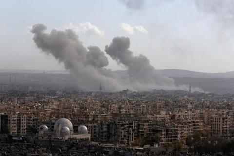 A general view shows rising smoke after strikes on Aleppo city, Syria, December 3, 2016. PHOTO BY REUTERS/Omar Sanadiki