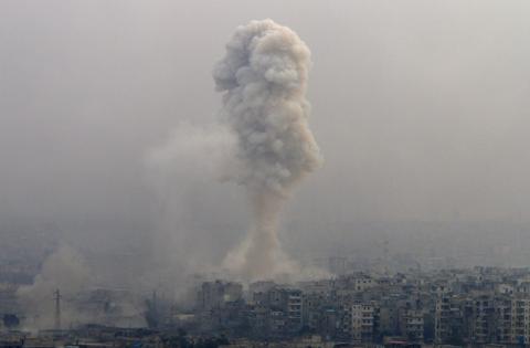 Smoke rises after air strikes on rebel-controlled besieged eastern Aleppo, Syria, December 5, 2016. PHOTO BY REUTERS/Omar Sanadiki