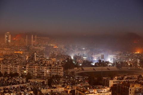 Smoke and flames rise after air strikes on rebel-controlled besieged area of Aleppo, as seen from a government-held side, in Syria, December 11, 2016. PHOTO BY REUTERS/Omar Sanadiki