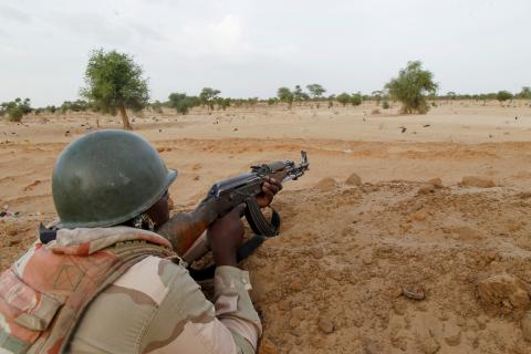 A Niger soldier guards with his weapon pointed towards the border with neighbouring Nigeria, near the town of Diffa, Niger, June 21, 2016. PHOTO BY REUTERS/Luc Gnago