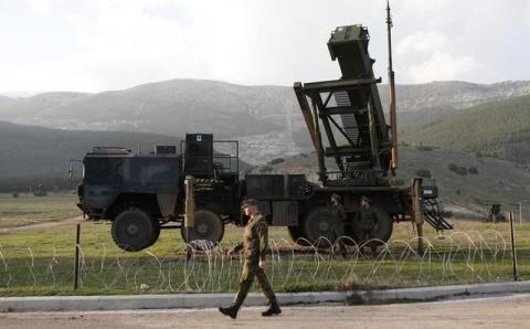 Soldiers of the German armed forces Bundeswehr stand next to the Patriot system before the arrival of Germany's Chancellor Angela Merkel at a Turkish military base in Kahramanmaras, February 24, 2013. PHOTO BY REUTERS/Murad Sezer