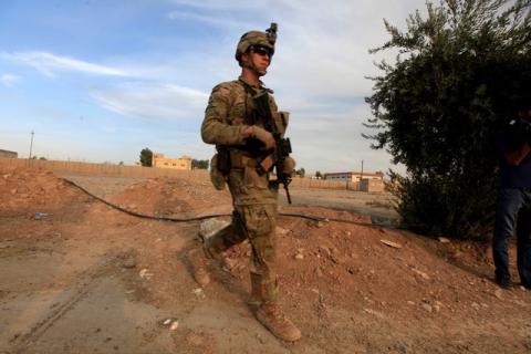 A U.S army soldier walks with his weapon at a military base in the Makhmour area near Mosul during an operation to attack Islamic State militants in Mosul, Iraq, October 18, 2016. PHOTO BY REUTERS/Alaa Al-Marjani