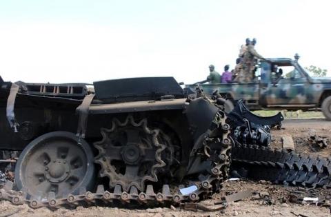 Sudan People’s Liberation Movement (SPLM) soldiers drive past military tanks that were destroyed and abandoned in the recent fighting in the Jabel area of Juba, South Sudan, July 16, 2016. REUTERS/Stringer