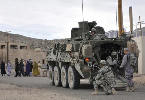 Soldiers from U.S. Army Alpha Company, 2-3 Inf, 3-2 SBCT, patrol a village with Afghan forces at the National Training Center in Fort Irwin, California, U.S. on August 13, 2011. PHOTO BY REUTERS/Courtesy Ryan Hallock/U.S. Army
