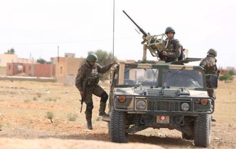 Soldiers patrol after an attack by Islamic State militants on army and police barracks in the town of Ben Guerdan, Tunisia, near the Libyan border, March 8, 2016. PHOTO BY REUTERS/Zoubeir Souissi