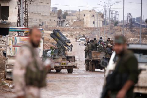 Syrian government soldiers gather in Al-Haidariya neighbourhood after government forces took control of the area in Aleppo, Syria, December 2, 2016. PHOTO BY REUTERS/Omar Sanadiki