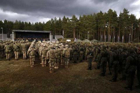 Polish and U.S. soldiers attend welcoming ceremony for U.S.-led NATO troops at polygon near Orzysz, Poland, April 13, 2017. PHOTO BY REUTERS/Kacper Pempel