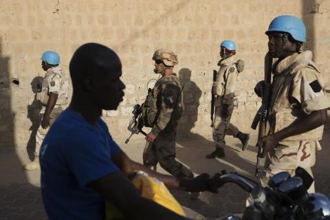 French soldiers and United Nations peacekeepers from Burkina Faso patrol in Timbuktu, Mali, November 5, 2014. PHOTO BY REUTERS/Joe Penney