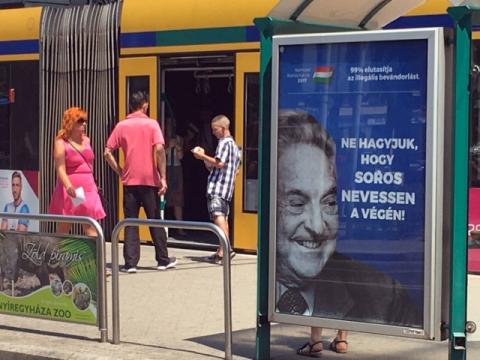 Hungarian government poster portraying financier George Soros and saying "Don't let George Soros have the last laugh" is seen at a tram stop in Budapest, Hungary, July 6, 2017. PHOTO BY REUTERS/Krisztina Than