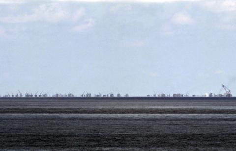 The alleged on-going land reclamation of China at Subi reef is seen from Pagasa island (Thitu Island) in the Spratlys group of islands in the South China Sea, west of Palawan, Philippines, May 11, 2015. PHOTO BY REUTERS/Ritchie B. Tongo