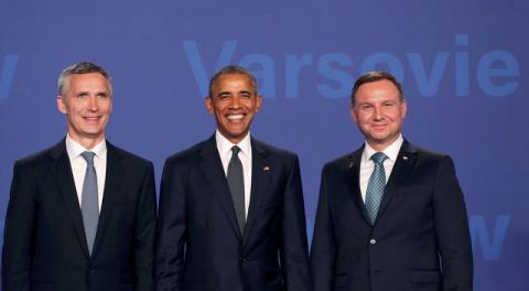 U.S. President Barack Obama (C) poses for a picture next to Poland's President Andrzej Duda (R) and NATO Secretary-General Jens Stoltenberg as he arrives at the NATO Summit at PGE National Stadium in Warsaw, Poland, July 8, 2016. PHOTO BY REUTERS/Slawomir Kaminski