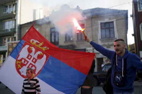 A supporter of Radical Party leader Vojislav Seselj lights a flare before Seselj's pre-election rally in Jagodina, Serbia, April 12, 2016. PHOTO BY REUTERS/Marko Djurica