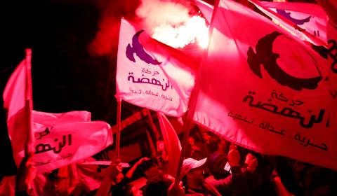 Supporters of the Islamist Ennahda party celebrate outside the party's headquarters after claiming victory in a local poll in Tunis, Tunisia, May 6, 2018. PHOTO BY REUTERS/Zoubeir Souissi