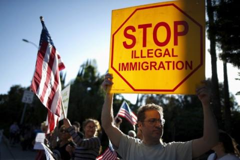 Trump supporters protest outside the Luxe Hotel, where Republican presidential candidate Donald Trump was expected to speak in Brentwood, Los Angeles, California, United States, July 10, 2015. PHOTO BY REUTERS/Lucy Nicholson