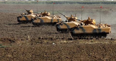 Turkish armoured personnel carriers (APC) maneuver during a military exercise near the Turkish-Iraqi border in Silopi, Turkey, September 23, 2017. PHOTO BY REUTERS/Umit Bektas