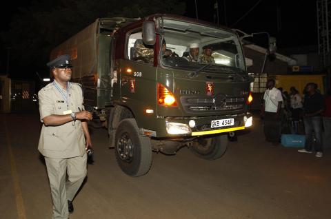 A police truck carrying the bodies of passengers who were killed during an ambush on a Nairobi-bound bus outside Mandera town, leaves the Wilson airport in the capital Nairobi, November 22, 2014. PHOTO BY REUTERS/Thomas Mukoya