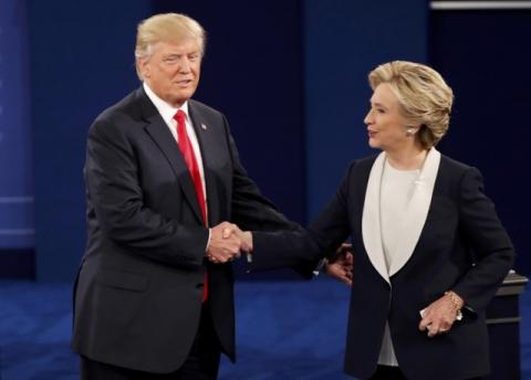 Republican U.S. presidential nominee Donald Trump and Democratic U.S. presidential nominee Hillary Clinton shake hands at the conclusion of their presidential town hall debate at Washington University in St. Louis, Missouri, U.S., October 9, 2016. PHOTO BY REUTERS/Lucy Nicholson
