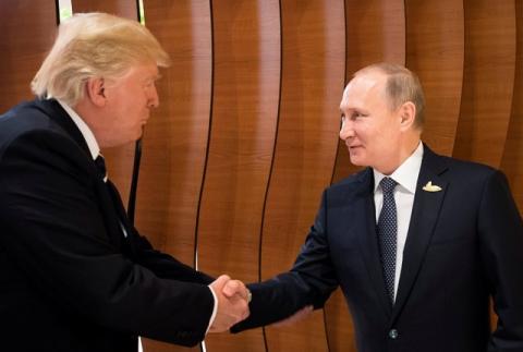 U.S. President Donald Trump and Russia's President Vladimir Putin shake hands during the G20 Summit in Hamburg, Germany in this still image taken from video, July 7, 2017. PHOTO BY REUTERS/Steffen Kugler/Courtesy of Bundesregierung