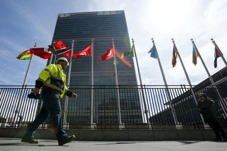 A man walks in front of the United Nations headquarters where the Permanent Memorial to Honour the Victims of Slavery and the Transatlantic Slave Trade "The Ark of Return" is to be unveiled in New York, March 25, 2015. PHOTO BY REUTERS/Eduardo Munoz