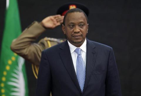 Kenya's President Uhuru Kenyatta stands for Kenya's national anthem before the Africa Union Peace and Security Council Summit on Terrorism at the Kenyatta International Convention Centre in Nairobi, September 2, 2014. PHOTO BY REUTERS/Thomas Mukoya