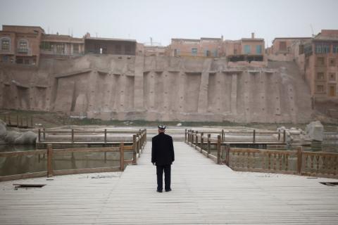 An ethnic Uighur looks at the old town in Kashgar, Xinjiang Uighur Autonomous Region, China, March 23, 2017. PHOTO BY REUTERS/Thomas Peter