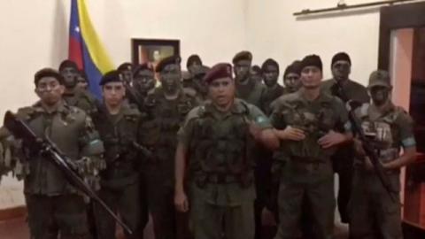 A still image from video released by Operation David Carabobo purportedly shows a group of men dressed in military uniforms announcing uprising in Valencia, Venezuela, August 6, 2017. PHOTO BY REUTERS/Operation David Carabobo