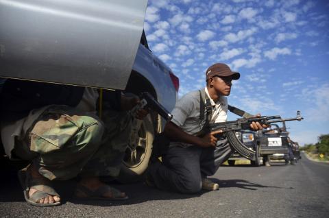 Vigilantes stand guard after hearing rumours of a possible ambush in Tierra Caliente 