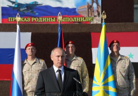 Russian President Vladimir Putin addresses servicemen as he visits the Hmeymim air base in Latakia Province, Syria, December 11, 2017. PHOTO BY REUTERS/Sputnik/Mikhail Klimentyev