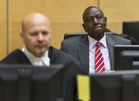 Kenya's Deputy President William Ruto (R) reacts as he sits in the courtroom before his trial at the International Criminal Court (ICC) in The Hague, September 10, 2013. PHOTO BY REUTERS/Michael Kooren