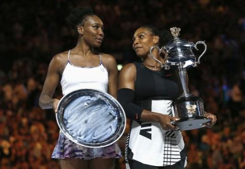 Serena Williams of the U.S. holds her trophy after winning her Women's singles final match against Venus Williams of the U.S. Australian Open, Melbourne Park, Melbourne, Australia, January, 28, 2017. PHOTO BY REUTERS/Issei Kato