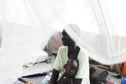 A woman suffering from Tuberculosis (TB) holds her baby, who suffers from TB and malnutrition, in a hospital in Minakaman, Lakes State, June 26, 2014. PHOTO BY REUTERS/Andreea Campeanu
