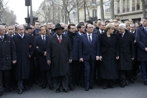 French President Francois Hollande is surrounded by head of states as they attend the solidarity march (Rassemblement Republicain) in the streets of Paris, January 11, 2015. PHOTO BY REUTERS/Philippe Wojazer