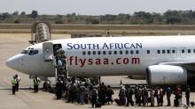 Passengers board a South African Airways Boeing 737 aircraft at the Kamuzu International Airport in Lilongwe, file. PHOTO BY REUTERS/Siphiwe Sibeko