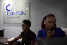 Women work at the front desk of the Centum Investment Company Limited in Nairobi, Kenya, November 11, 2015. PHOTO BY REUTERS/Siegfried Modola