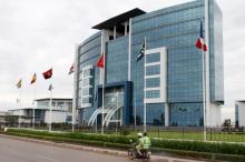 A motorcyclist rides past the Ecobank headquarters in Lome, Togo, June 6, 2015. PHOTO BY REUTERS/Noel Kokou Tadegnon