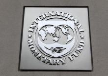 The International Monetary Fund (IMF) logo is seen at the IMF headquarters building during the 2013 Spring Meeting of the International Monetary Fund and World Bank in Washington, April 18, 2013. PHOTO BY REUTERS/Yuri Gripas