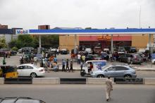 People queue with their vehicles to buy fuel in front of a fuel station at Agege district in Lagos, Nigeria, April 5, 2016. PHOTO BY REUTERS/Akintunde Akinleye