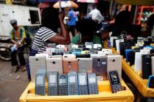 Nokia phone models are displayed for sale along with smartphones at the 'Computer Village' in Ikeja district, in Nigeria's commercial capital Lagos, Nigeria, May 31, 2017. PHOTO BY REUTERS/Akintunde Akinleye