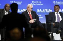 Donald Kaberuka (L) takes a question from the audience as he leads a panel discussion including Carlyle Group CEO (C) and Standard Bank Chief Executive Sim Tshabalala (R) during the U.S.-Africa Business Forum in Washington, August 5, 2014. PHOTO BY REUTERS/Jonathan Ernst