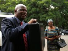 Zimbabwean Finance Minister Patrick Chinamasa reacts as he arrives to present his budget at Parliament in Harare, Zimbabwe, December 7, 2017. PHOTO BY REUTERS/Philimon Bulawayo